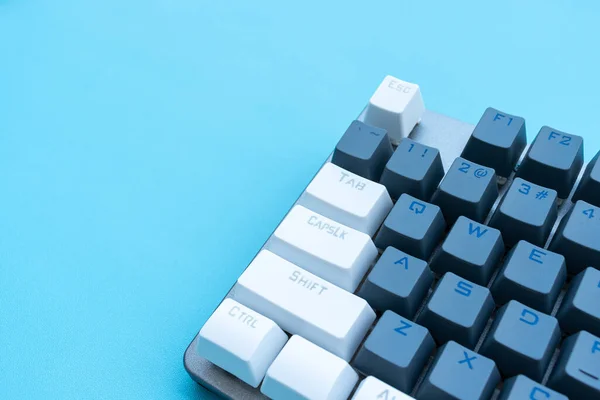 Mechanical keyboard isolated on blue background. After some edits.