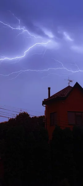 Edited photo of the house. Powerful lightning