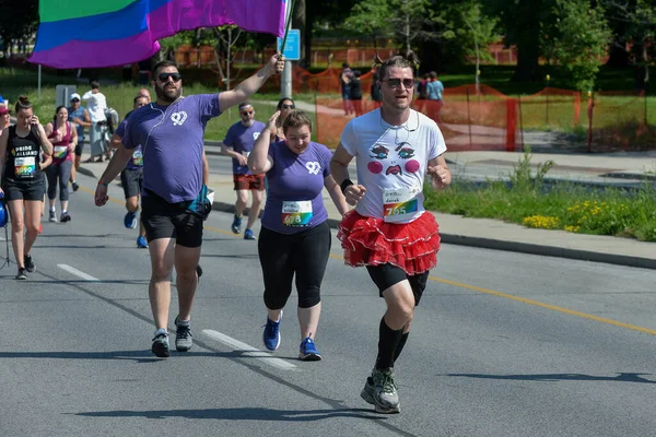 stock image Toronto, ON, Canada - June 22, 2019: Runner takes part in amateur sports run competition during the Pride month in Toronto