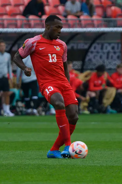 stock image Toronto, ON, Canada - June 27, 2023:  Cdric Avinel #13 passes the ball during the 2023 Concacaf Gold Cup match between national team of Canada and Guadeloupe (Score 2:2).