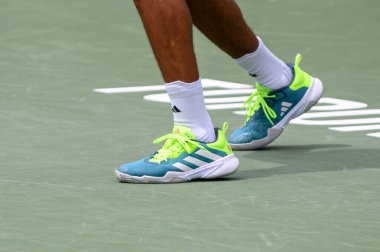 Toronto, ON, Canada - August 5, 2023: View at tennis sneakers of Felix Auger-Aliassime during the the National Bank Open at Sobeys Stadium in Toronto clipart