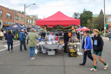 Toronto, ON, Canada - September 7, 2024: People outside enjoying the annual street festival Taste of The Kingsway 2024 clipart