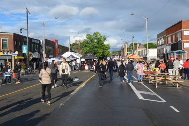 Toronto, ON, Canada - September 7, 2024: People outside enjoying the annual street festival Taste of The Kingsway 2024 clipart