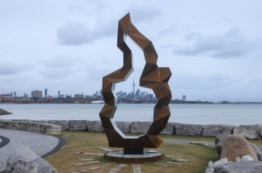 Toronto, ON, Canada - January 1, 2025: Campfire, a new Indigenous-led public art installation at Humber Bay Shores created by Canadian sculptor Michael Belmore, of Anishinaabe descent, in collaboration with Herman Mejia. clipart