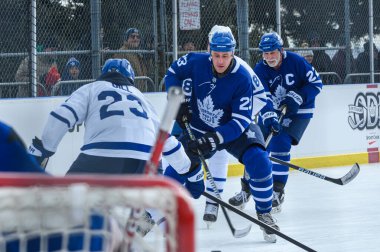 Toronto, ON, Canada  January 26, 2025: Toronto Maple Leafs Alumni player #23 Shawn Matthias moves on the ice during the outdoor practice Alumni Blue and White Game presented by SportChek. clipart