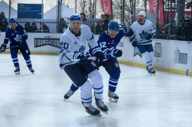 Toronto, ON, Canada  January 26, 2025: Toronto Maple Leafs Alumni #20 Frank Corrado on the ice during the outdoor practice Alumni Blue and White Game presented by SportChek. clipart