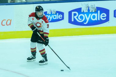 Toronto, ON, Canada  February 1, 2025:  #71 Jincy Roese defender of Ottawa Charge plays with the puck during the Toronto Sceptres vs Ottawa Charge game at Coca-Cola Coliseum (Score 4-2 Toronto Sceptres won). clipart