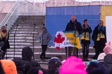 Toronto, ON, Canada  March 3, 2025: People participate in the Ukrainian Rally for Truth and Justice in front of the USA Consulate. clipart