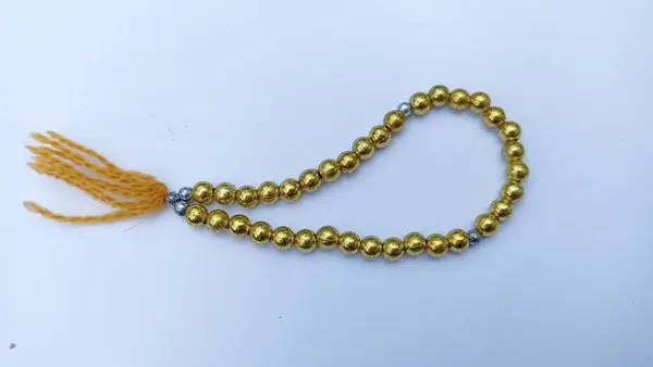 Gold Beads Blue Background — Stock Photo, Image