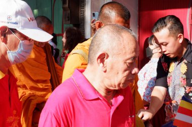 the buddist priest is being procession of worship.indonesia, , prosesi thudong, biksu bante budha berjalan kaki, dari thailand ke candi borobudur di Indoneisa, hari waisak, nampak para biksu berjalan membawa wadah menerima sumbangan dari orang lain