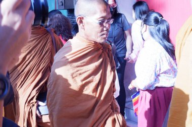 the buddist priest is being a procession of worship, prosesi thudong, biksu bante budha berjalan kaki, dari thailand ke candi borobudur di Indoneisa, hari waisak, nampak para biksu berjalan membawa wadah menerima sumbangan dari orang lain