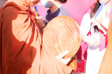 the buddist priest is being a procession of worship, prosesi thudong, biksu bante budha berjalan kaki, dari thailand ke candi borobudur di Indoneisa, hari waisak, nampak para biksu berjalan membawa wadah menerima sumbangan dari orang lain