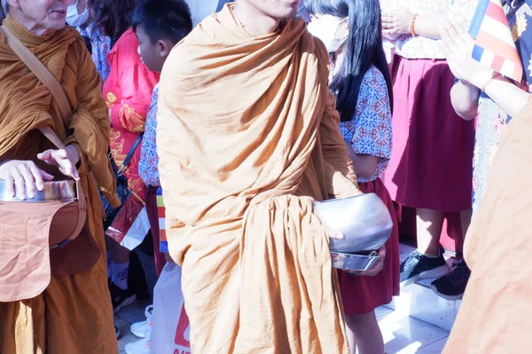 the buddist priest is being procession of worship.indonesia, , prosesi thudong, biksu bante budha berjalan kaki, dari thailand ke candi borobudur di Indoneisa, hari waisak, nampak para biksu berjalan membawa wadah menerima sumbangan dari orang lain