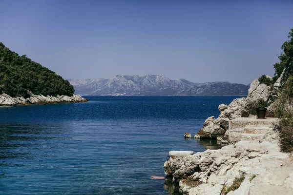 stock image Landscape of the Adriatic Sea, mountains with clouds, sky, rocks on a sunny day. Dalmatia, Croatia.