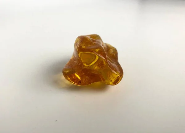 stock image Polished nugget of Baltic amber found in Kolobrzeg, Poland.