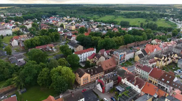 stock image Trzebiatws city center, founded in medieval times, is home to a Gothic red-brick church with Polands 3rd tallest tower. The historic beauty of the church defines the skyline.