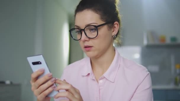 Woman Shocked Content She Suddenly Watched Smartphone Spam Letters — Stock Video