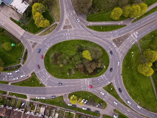Roundabout from a drone view busy with cars