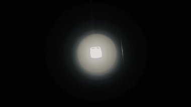Flashing light towards the broken camera lens