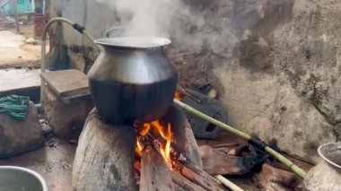 Cooking with firewood in a traditional village food preparation method