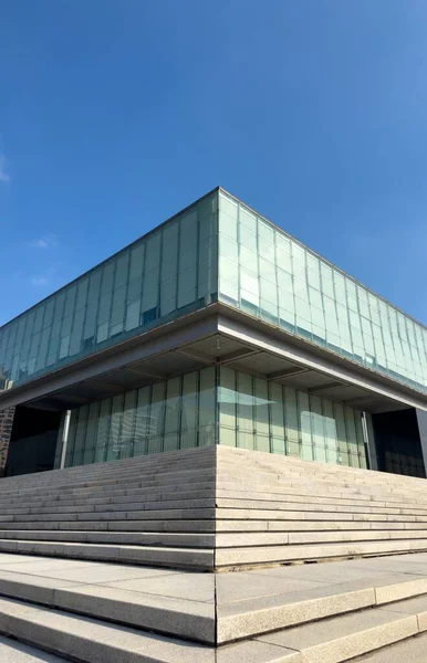 stock image Shanghai Pudong Exhibition Hall stands under the blue sky, embodying the beauty of symmetry and vigorous vitality.