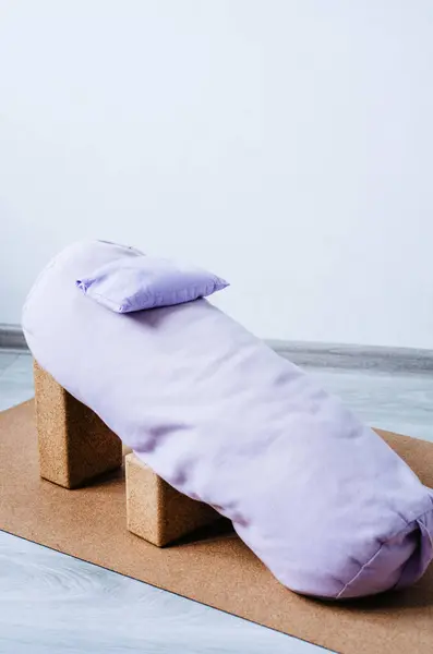Bolster, blocks and eye pillow - props setting for relaxing yin, restorative yoga