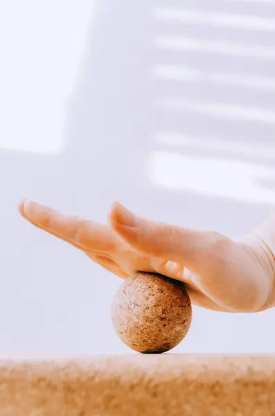 stock image Close up of hand doing palm fascia release exercise with cork ball