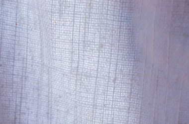 Beyaz örülmüş keten kumaş dokusunun yakın çekimi