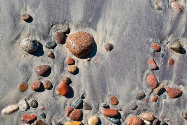 stock image Sea stones on a wet sand background texture image