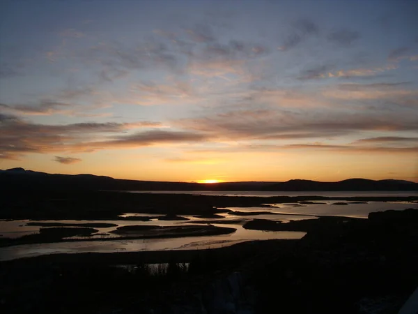 Iceland orange sunrise mid morning with reflections
