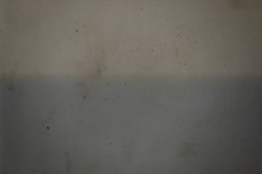 Hafifçe kirli, bembeyaz bir plastik yüzeyin hafif bir ışık gradyanı olan minimalist soyut bir dokusu.