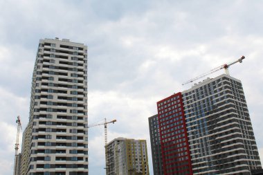 new residential buildings in Kyiv, the capital of Ukraine. new buildings and houses being built with construction cranes