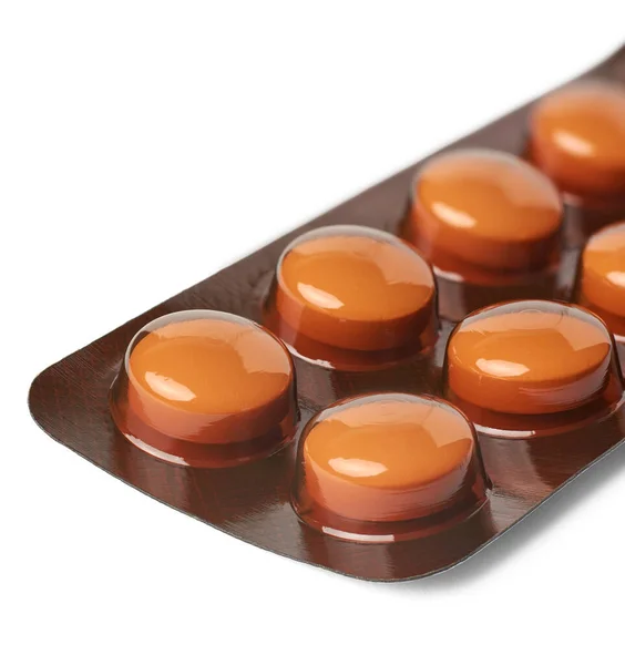 Zbliżenie Pomarańczowych Tabletek Blistrze Opakowanie Medyczne Odizolowane Białym Tle Ostrość — Zdjęcie stockowe
