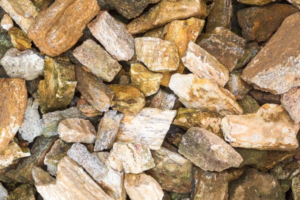 pile of stones pieces for construction, split or broken rock, background texture