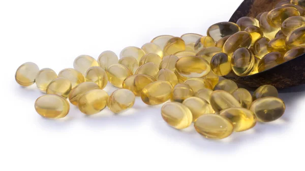 Petrol kapsülleri, omega 3 ve vitamin takviyesi, beyaz arka planda izole edilmiş, sağlıklı yaşam tarzı kavramına yakın görüş