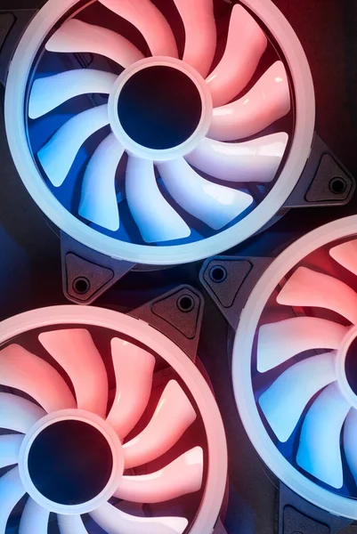 stock image close-up of cooling fans, cooling computers and other electronic equipments with a black background, taken straight from above