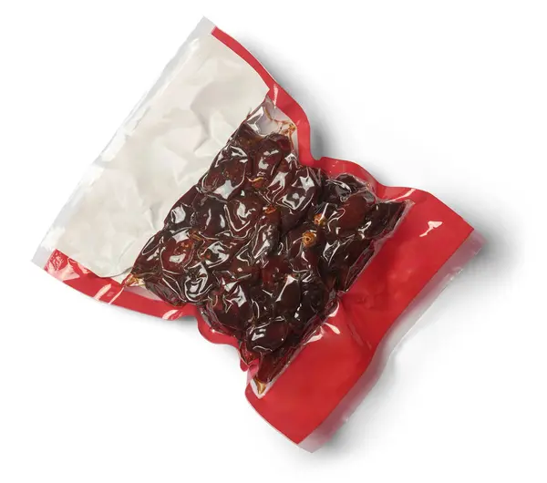 真空封包的日期 热带甜水果在热成型包装在软膜隔离白色背景 模型模板图形设计与空白标签 免版税图库图片