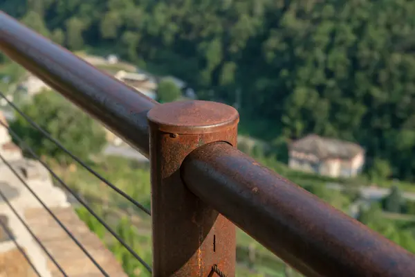 stock image detail of the stainless steel rope railing offers safety and modern design, while the corten steel structure ensures resistance to atmospheric agents. combination for durability and elegance, in use for contemporary architectural space projects.