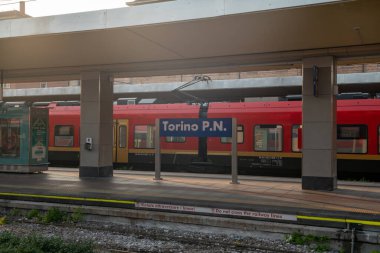 sign indicating the Porta Nuova station in Turin, the point of arrival and departure in the city center thanks to the network of trains and public transport. welcome to this wonderful city, which knows how to amaze with its beauty anyone who arrives. clipart