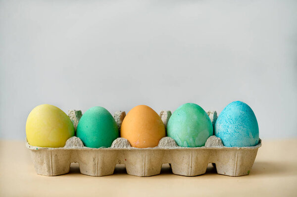 Colorful Painted Easter Eggs Paper Egg Container Beige Background Side Royalty Free Stock Photos