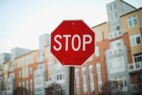 street sign with red stop signs