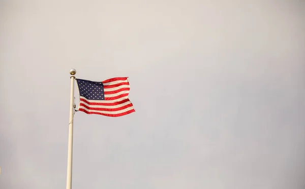 american flag on the background of the national flags of the united states of america