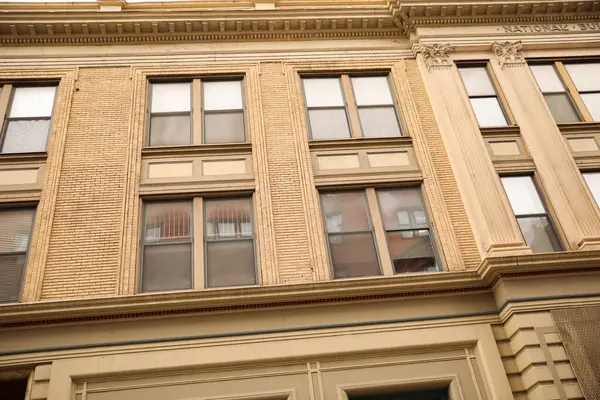 stock image facade of a building with windows and balconies