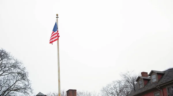 american flag on the background of the building