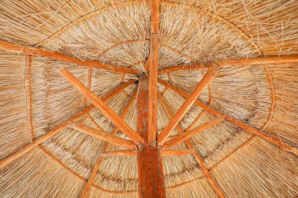 stock image palapa sun roof beach umbrella by the beach symbolizes relaxation, shade, and protection. It represents a tropical, beachy atmosphere and the desire to escape from the sun's harsh rays