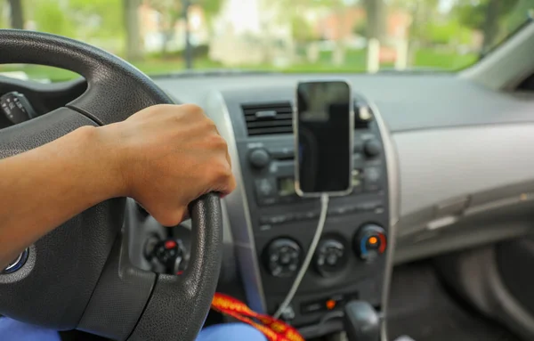 stock image hand on driving wheel symbolizes control, direction, and responsibility. It represents the power and freedom of mobility, as well as the need to be focused, alert, and responsible while driving