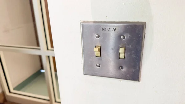 Light switch on and off symbolize control, illumination, and the power to change. They represent the ability to create or remove light, metaphorically representing decision-making and transformation