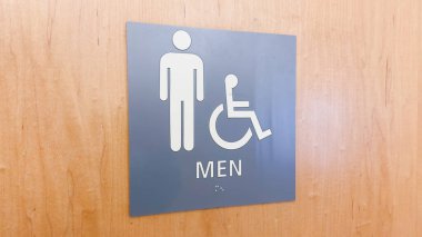 Kadın ve erkeğin cinsiyet simgelerini tasvir eden tuvalet imzası cinsiyet kimliği ve dahil olma sosyal sorunları sembolize ediyor.