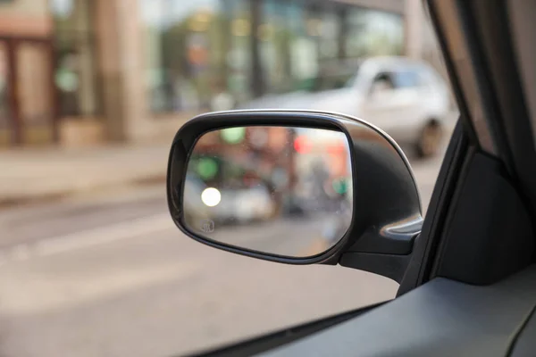 car mirror reflects both practicality and introspection, symbolizing self-reflection, awareness, and the ability to navigate lifes paths with foresight