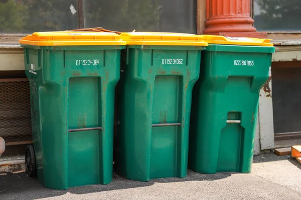 collection of old green trash bin.